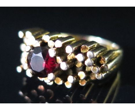 A 9ct Gold and Garnet Dress Ring, size M, 9.5 g