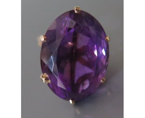 A Large Amethyst Dress Ring in yellow metal setting