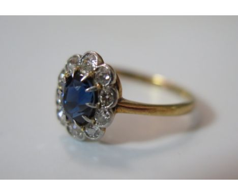 An 18 ct Gold, Sapphire and Diamond Cluster Ring, size K, 1.9 g