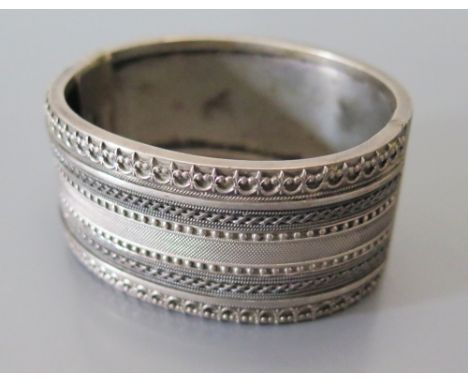 A 'STANDARD SILVER' Hinged Bangle