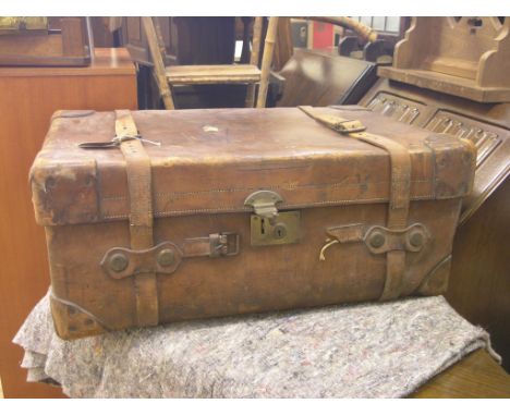 An early 20th century leather cabin trunk, with brass mounts, long oak coffee table, folding cake-stand, etc.