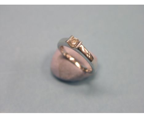 An 18ct. gold diamond solitaire ring, size M