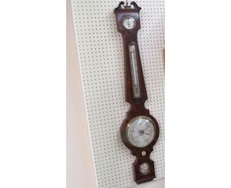 A Victorian mahogany wheel barometer, signed J. Denne, Cheltenham, with silvered thermometer, level, hygrometer and barometer
