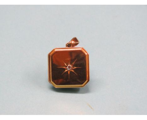 A 15ct. gold locket, set single small diamond, portrait photographs enclosed, 7.4 grams gross total