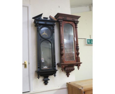 A 19th century walnut clock-case, architectural form, 3ft. 8in. and another, similar, ebonised finish 
