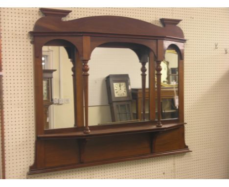 A late Victorian walnut overmantel, sectional mirror back with fitted shelf, 3ft. 6in.