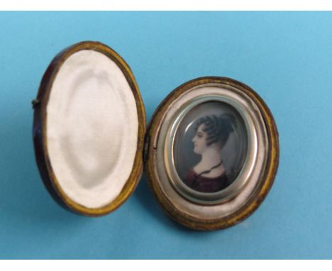 A small, early 19th century portrait miniature, young lady in profile, indistinctly signed, perhaps G. Smith, 1.5in., in hing