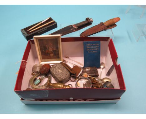 A 19th century coquilla nut carving, two daggers within sheaths, horseshoe egg-timer, etc.