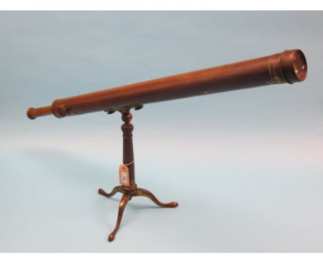 A large 19th century brass telescope, single-draw, adjustable on folding tripod stand, main barrel 34in.