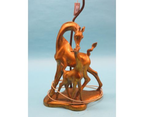 An ornamental gilt-metal table lamp, stem in the form of a horse and foal, with shade 