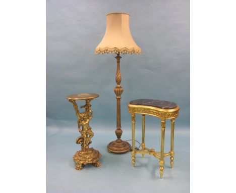 A Louis XV-style giltwood gueridon, with oval top, similar kidney-shape table with marble top, and a giltwood floor lamp with