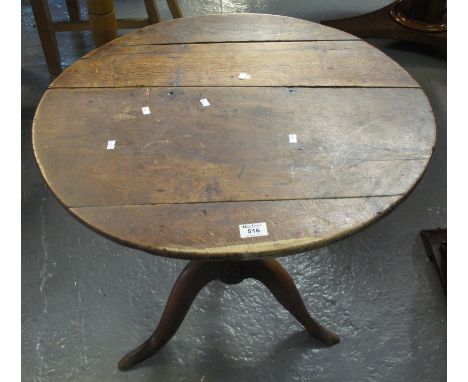19th Century oak tripod table.(B.P. 24% incl. VAT)