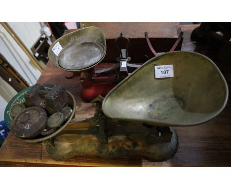 Two sets of cast metal kitchen scales with brass pans and various weights. (B.P. 24% incl. VAT)