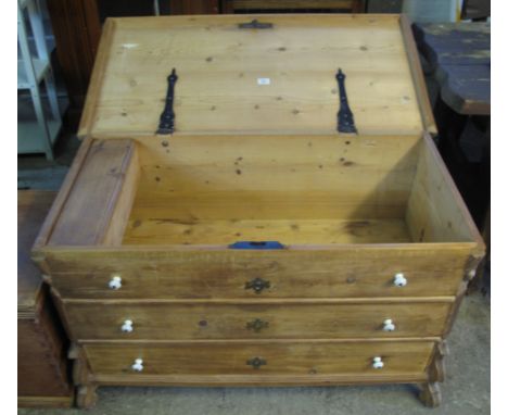 Natural pine trunk in the form of a chest of drawers with ceramic handles. (B.P. 24% incl. VAT) 