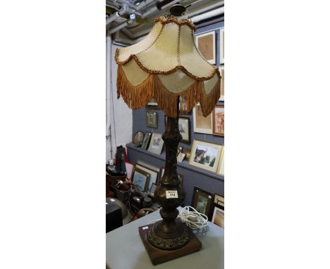 Japanese bronze lamp base of baluster form with relief decoration on a square wooden base, having 1920's fabric shade. Possib
