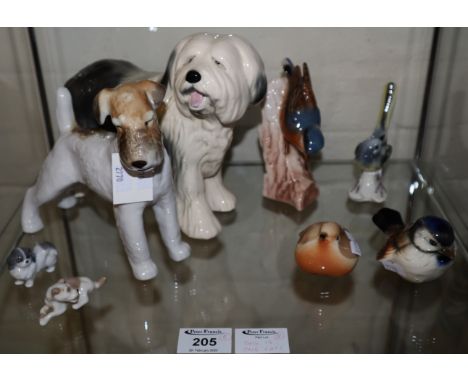 Collection of ceramic animals, various to include; Russian dogs, Goebel 1967 bird on stump, other birds, dogs etc. (8) (B.P. 