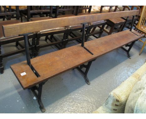 Early 20th Century pitch pine, open backed school or church bench with cast iron frame.(B.P. 24% incl. VAT)