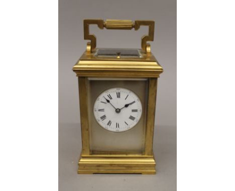 A Victorian brass cased repeating carriage clock. 18 cm high.