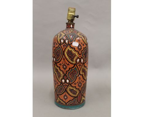 A Persian pottery lamp. 43 cm high.