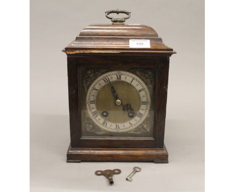 An early 20th century oak cased mantle clock. 29 cm high.