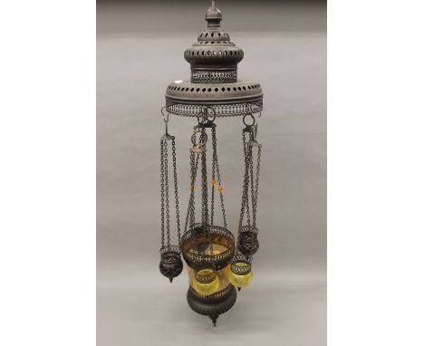 A Moroccan stained glass mounted hanging light. 94 cm high.