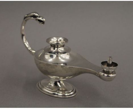 A novelty silver 'Aladdin's lamp' cigar lighter, Birmingham 1919.  14.5 cm long.  106.8 grammes total weight.