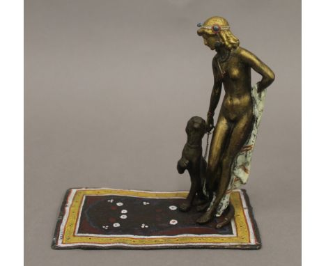 A cold painted bronze model of a girl and leopard. 16 cm high.