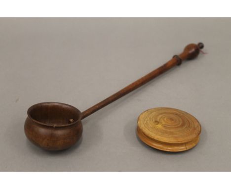 A treen box and ladle. The latter 33.5 cm long.
