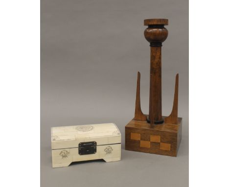 A bone trinket box and a wooden lamp stand. The latter 32 cm high.