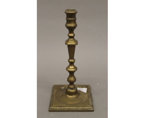 An 18th century brass candlestick. 26 cm high.  