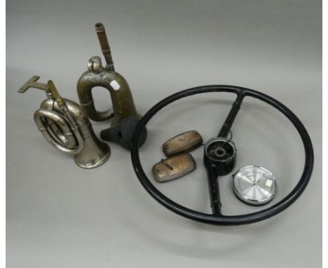 A quantity of vintage automobilia, including a Lucas King of the Road No.34 car/taxi horn and a steering wheel from an Austin