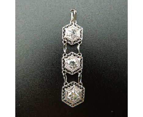 An Art Deco platinum diamond three section pendant. 3.5 cm high.