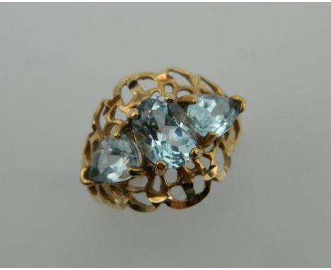 A 10 K gold three stone aquamarine ring. Ring Size P.