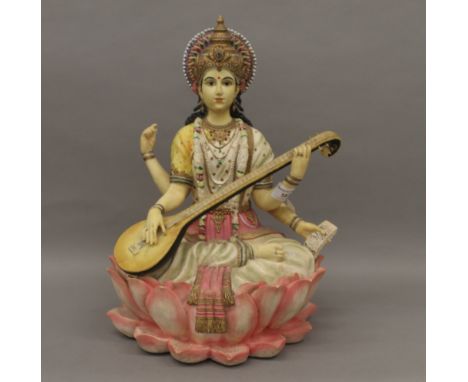 A resin model of a multi-armed deity. 37 cm high.