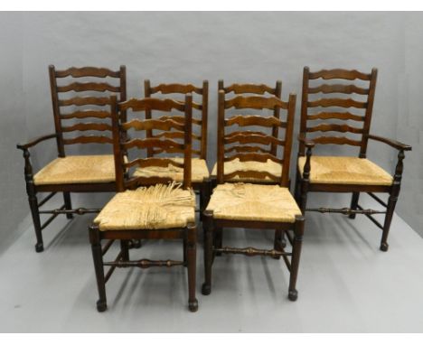 A set of six rush seated ladder back chairs. The carvers 59 cm wide.