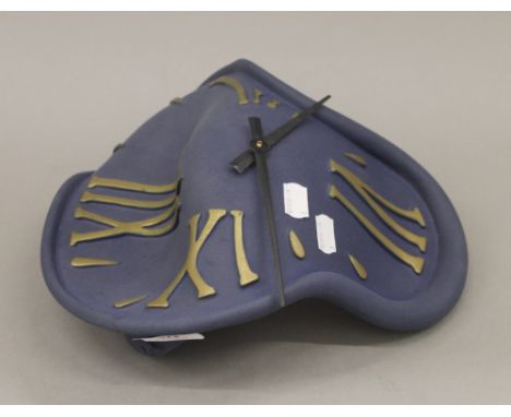 A vintage melting clock, in the manner of Salvador Dali. 30 cm high.