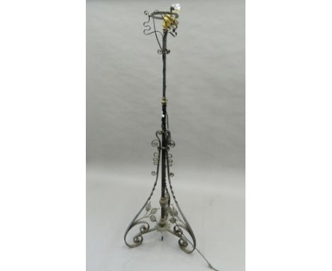 An early 20th century wrought iron and brass standard lamp. 163 cm high.