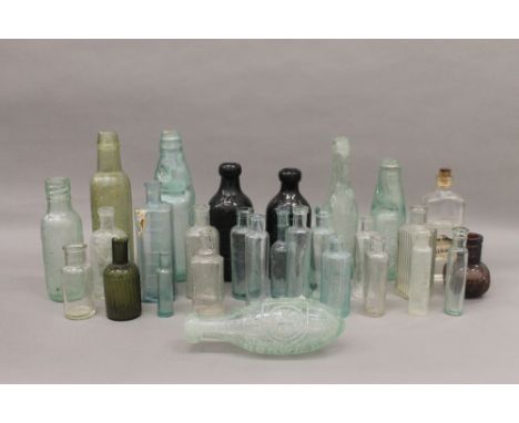 A quantity of vintage glass bottles