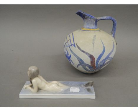 A Royal Copenhagen model of a mermaid and a pottery vase. The former 19.5 cm long.