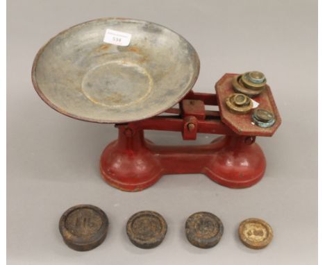 A set of vintage scales and weights. 31 cm wide.