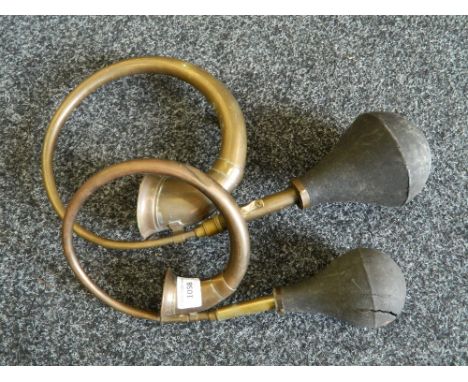 Two vintage car horns.