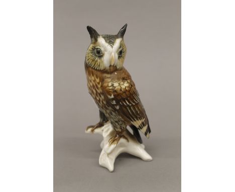 A porcelain model of an owl. 17 cm high.