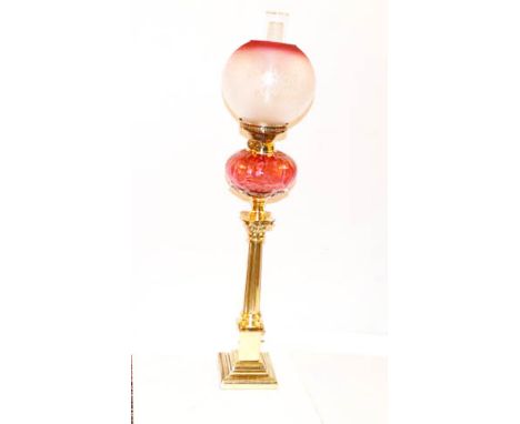 A Tall Brass Corinthian Pillar Oil Lamp, Ruby Bowl and Ruby Etched Shade