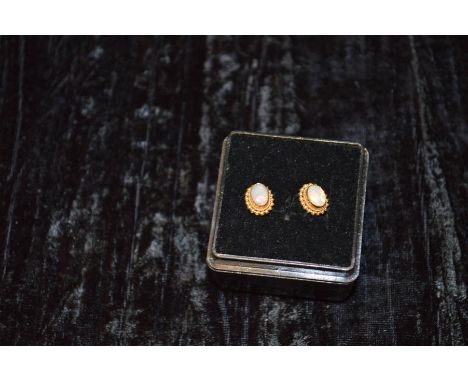 A Nice Pair of 9ct Gold and Opal Earrings 