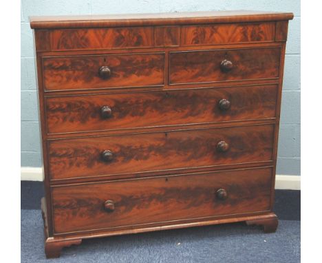VICTORIAN FLAME CUT MAHOGANY CHEST OF DRAWERS, the moulded oblong top above two concealed frieze drawers and two short and th