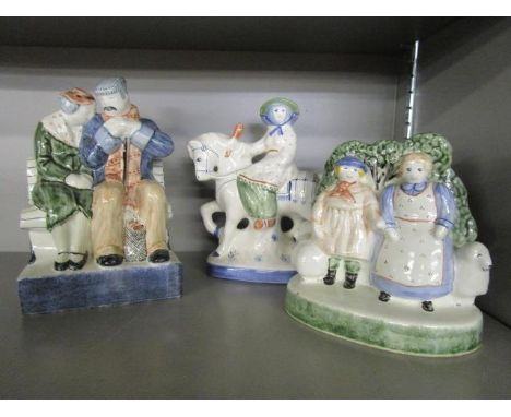 Three Rye pottery figure groups to include one of a couple seated on a park bench 