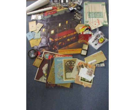 A vintage London Bus poster and others, a magnifying lens, a vintage alarm clock, vintage advertising food labels and ephemer