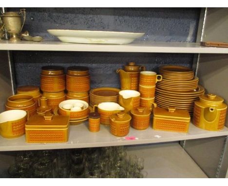 A selection of Hornsea 'Saffron' pottery to include storage jars, coffee and a teapot, plates, butter dishes and other items 