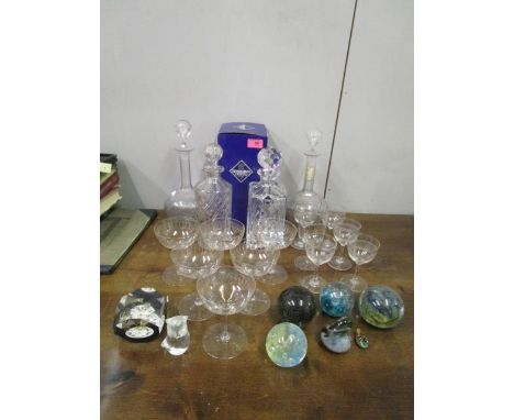 A selection of table glass and paperweights to include a boxed Edinburgh crystal decanter, an Isle of Wight cloudy paperweigh