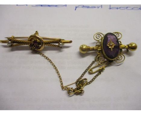 A Victorian yellow metal, amethyst and seed pearl brooch, together with a 15ct gold ruby and seed pearl brooch 